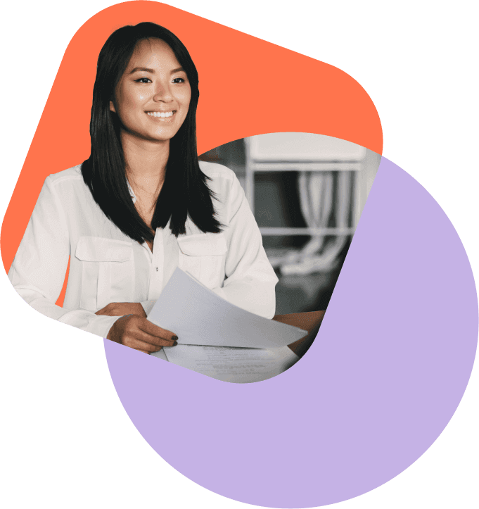 A smiling woman holds a few printed pages