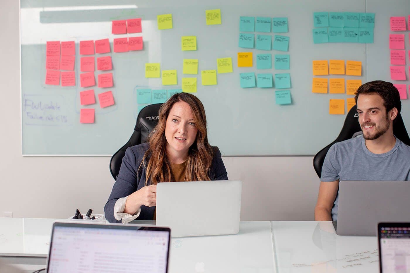Man and woman in workplace meeting