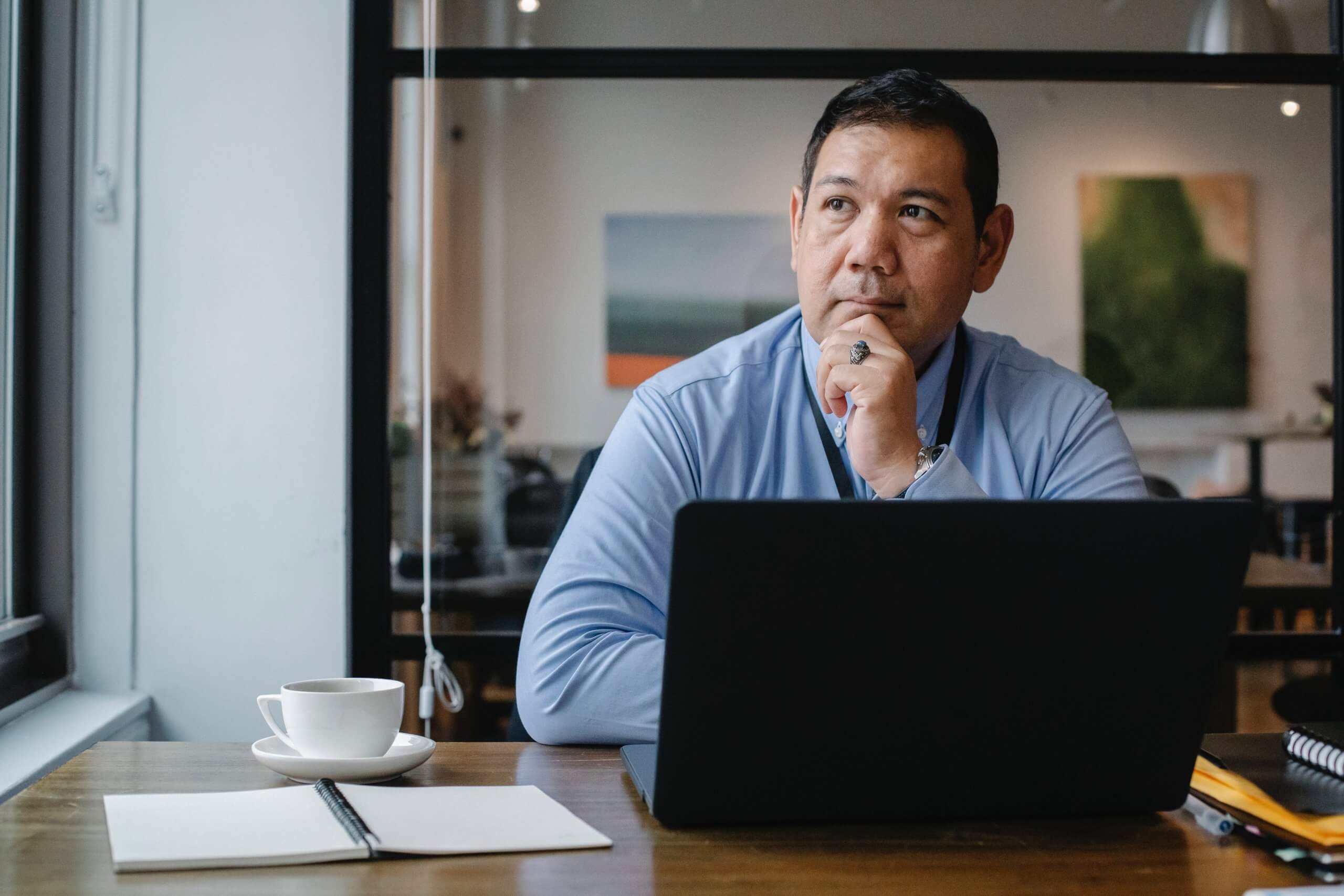 man in office thinking about his career development